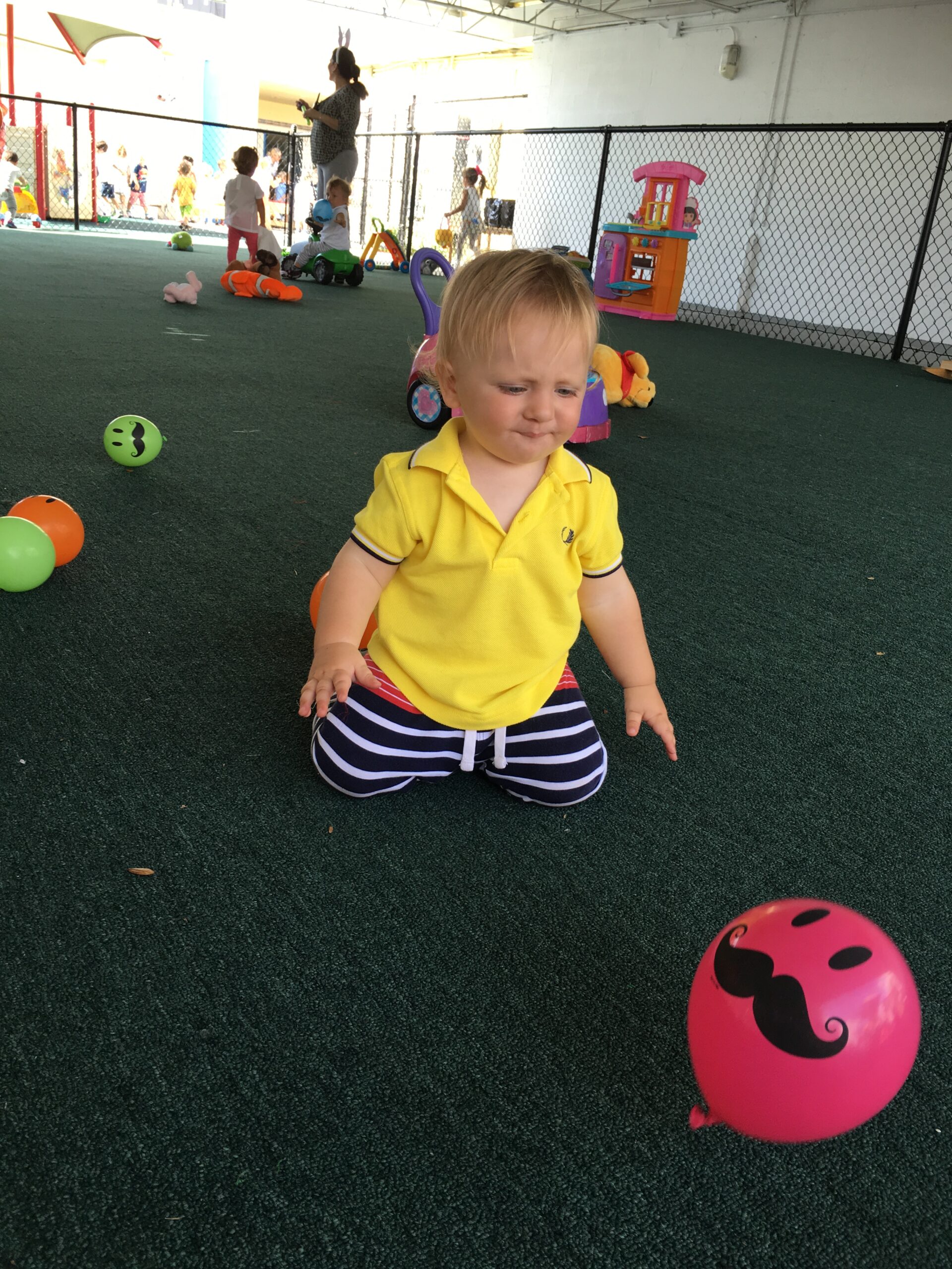 Toddler working with practical-life materials